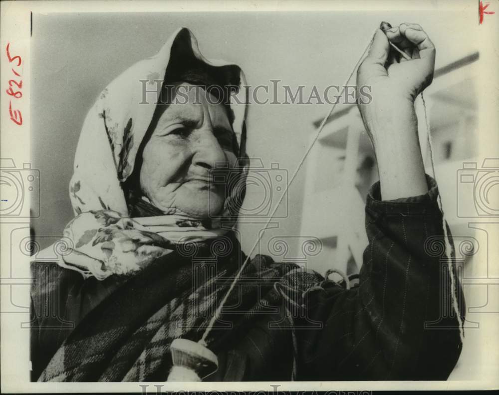 1966 Elderly woman spins wool - Soviet Caucuses mountain village - Historic Images