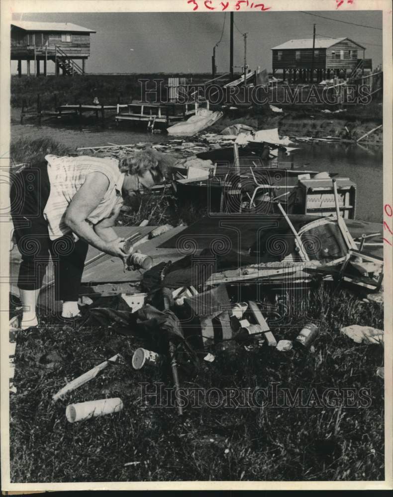 1969 Press Photo Mrs. R. G Ziese looks thru remains after tornado in Texas - Historic Images