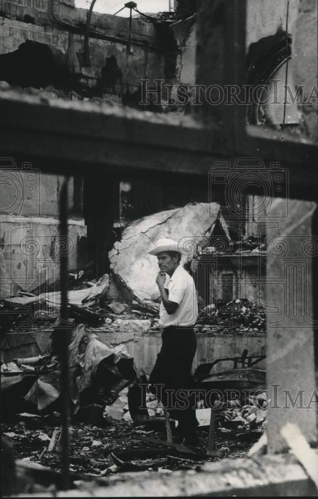 1971 Press Photo Man inspects church debris in San Juan, Texas - Historic Images