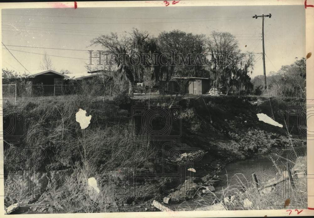 1959 D. Dean family home threatened by erosion of Vince Bayou, Texas - Historic Images