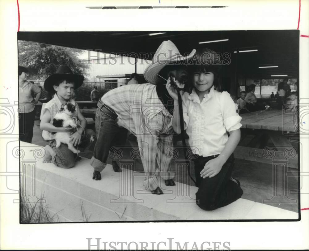1986 Jennifer and Louis Matuser with their pets-Waller County Fair - Historic Images