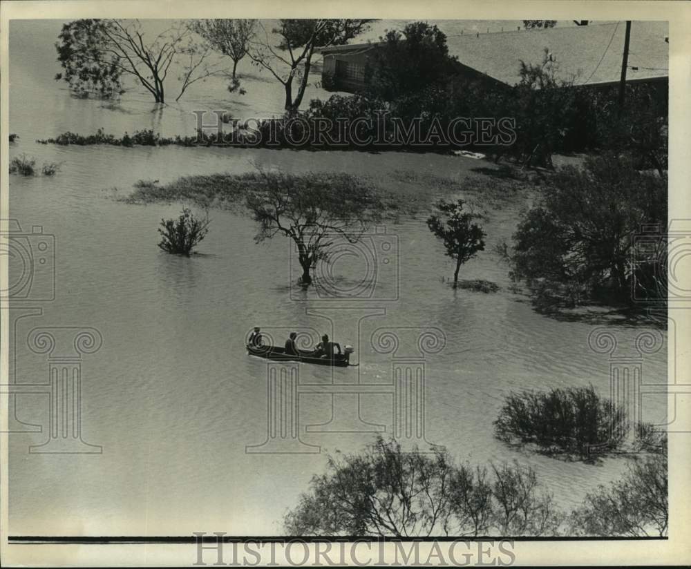 1967 People in boat - Flooded Texas homestead - Historic Images