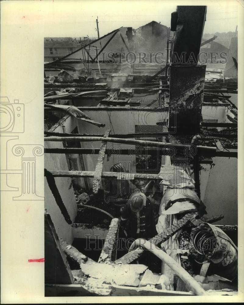 1973 Firemen inside heavily damaged unoccupied townhouses in Houston - Historic Images