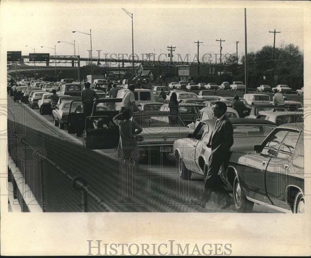 1971 People wait outside stuck cars on Southwest Freeway in Houston - Historic Images