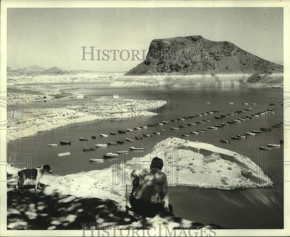 1966 Man looks at boats anchored in Truchas Lake, New Mexico-Historic Images