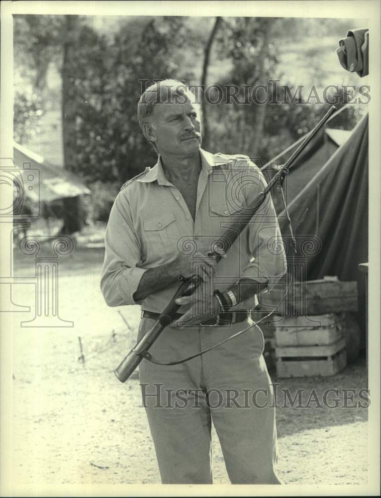 1988 Press Photo Actor Charlton Heston in Scene from "Nairobi Affair" - Historic Images