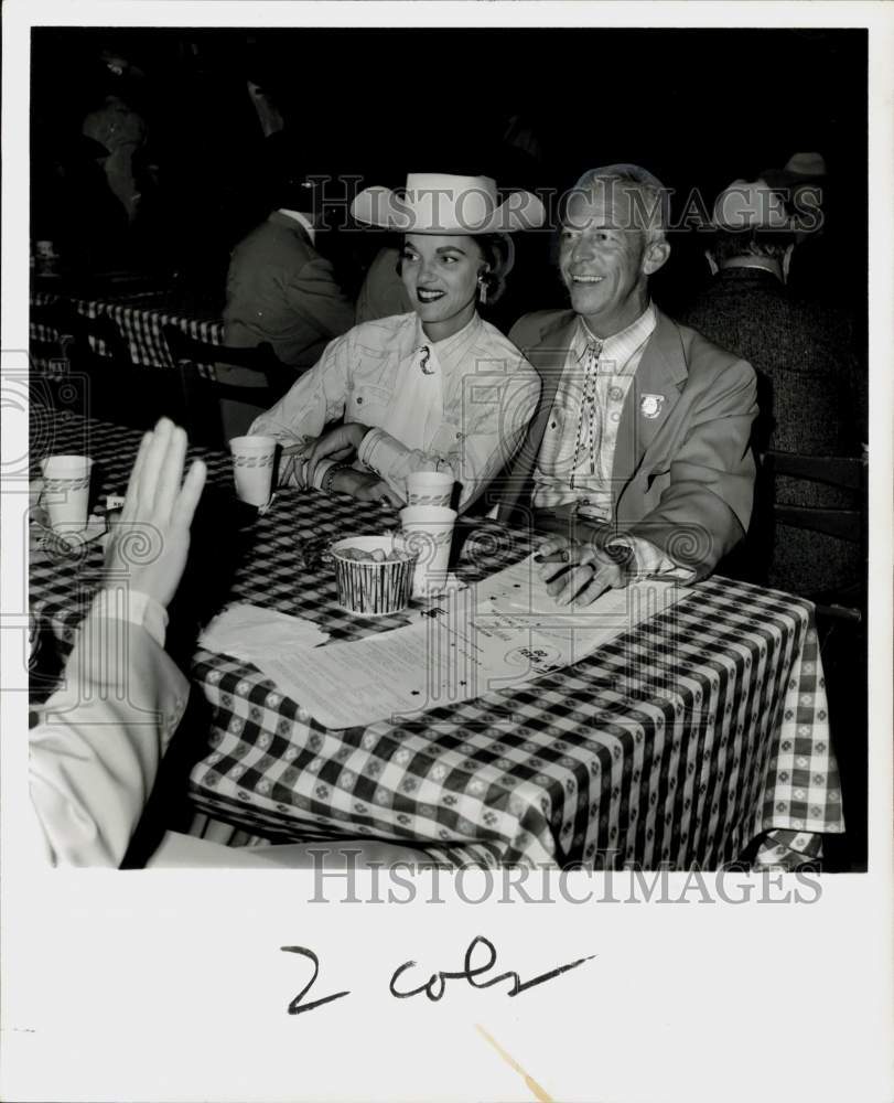 1961 Press Photo John and Ruth Cook, Grand Prize Beer executive, at party.- Historic Images