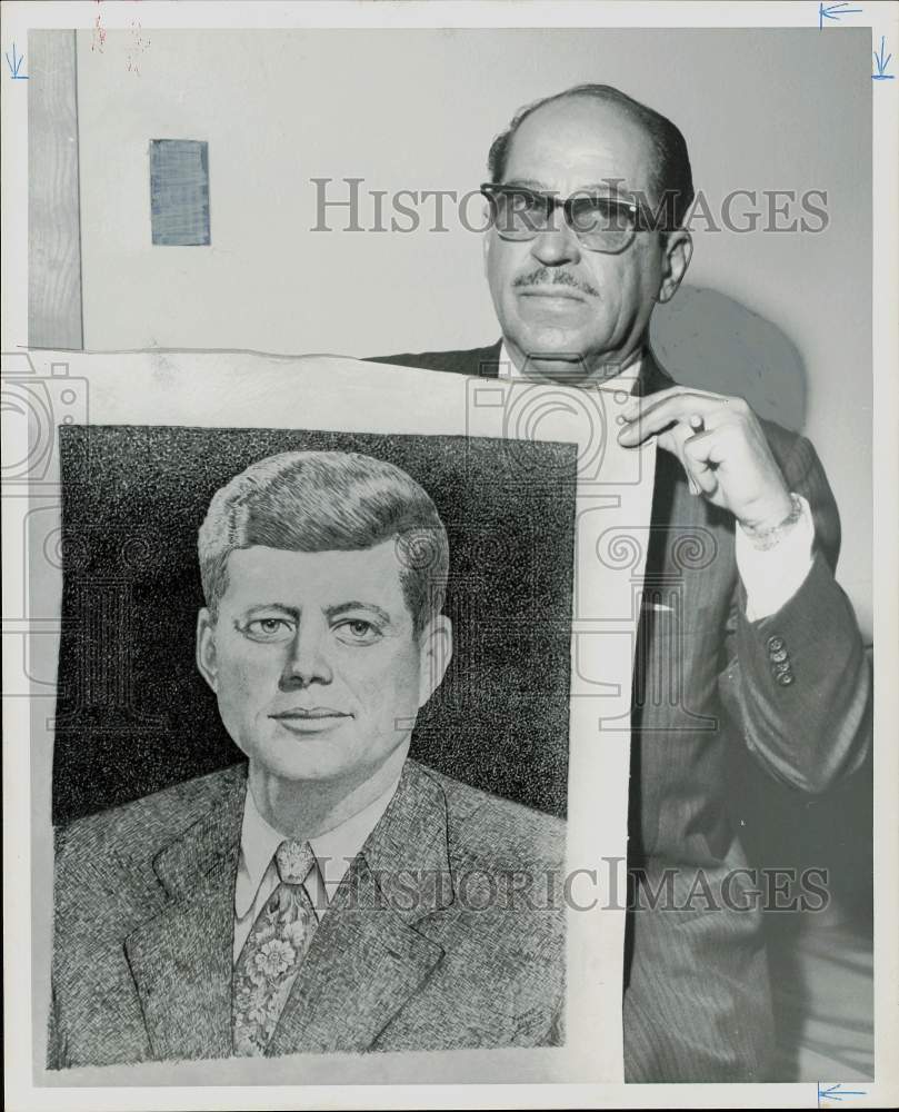 1961 Press Photo Manuel Colsa shows President Kennedy portrait on heavy cowhide.- Historic Images