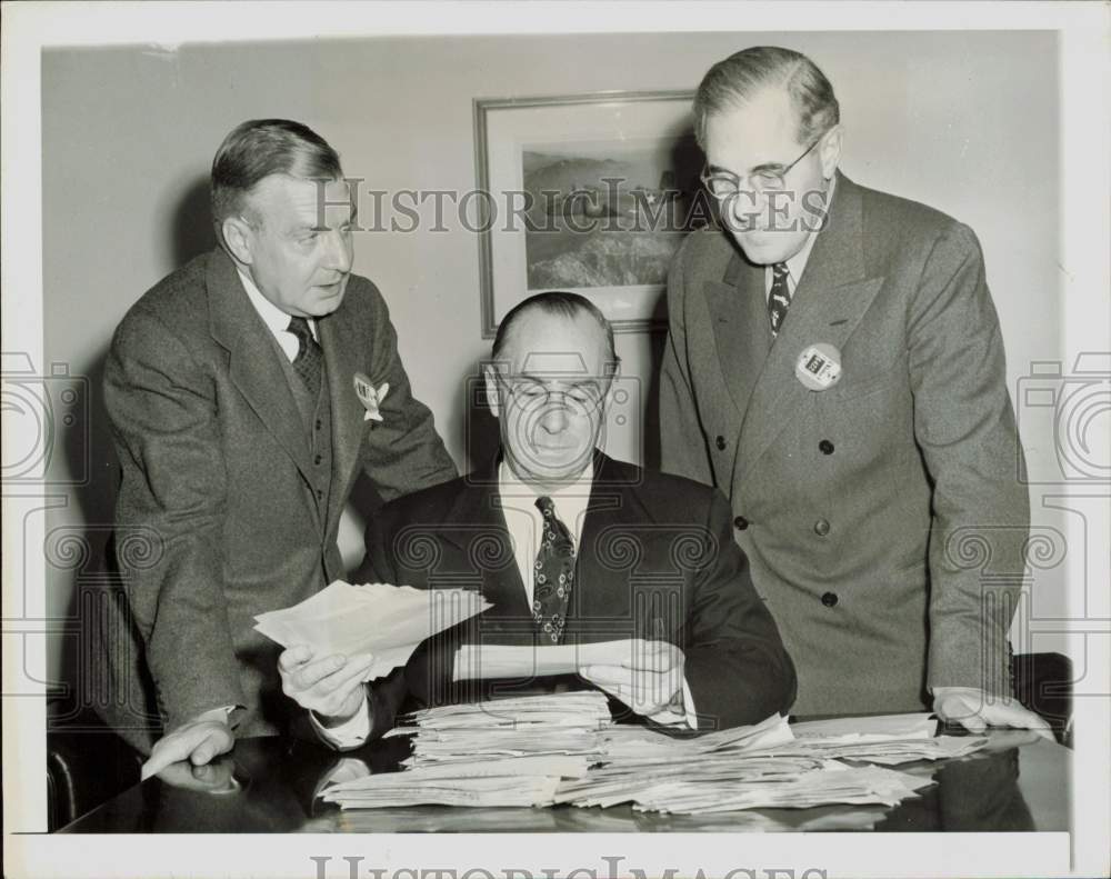 1943 Press Photo Donald Nelson and men look over telegrams in Washington, D.C.- Historic Images