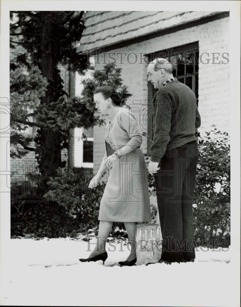 1963 Press Photo Mr. and Mrs. Dean Rusk view home snow scene in Washington.- Historic Images