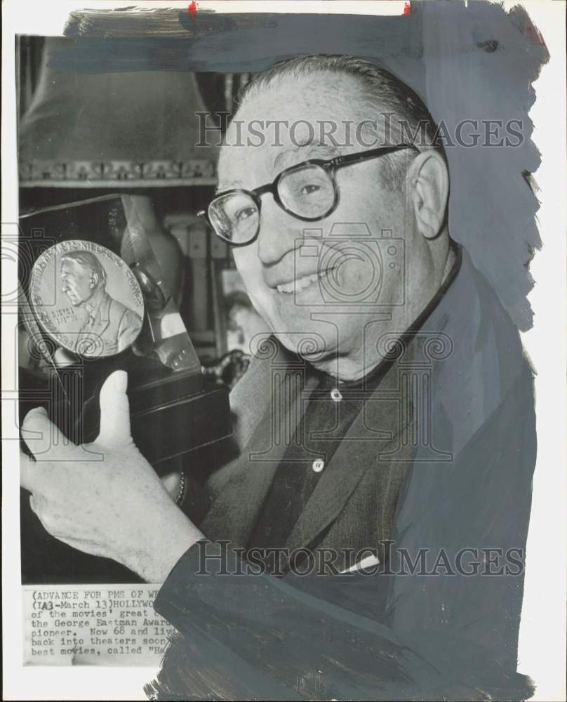 1962 Press Photo Harold Lloyd, movie producer, holds award. - hpa85294- Historic Images