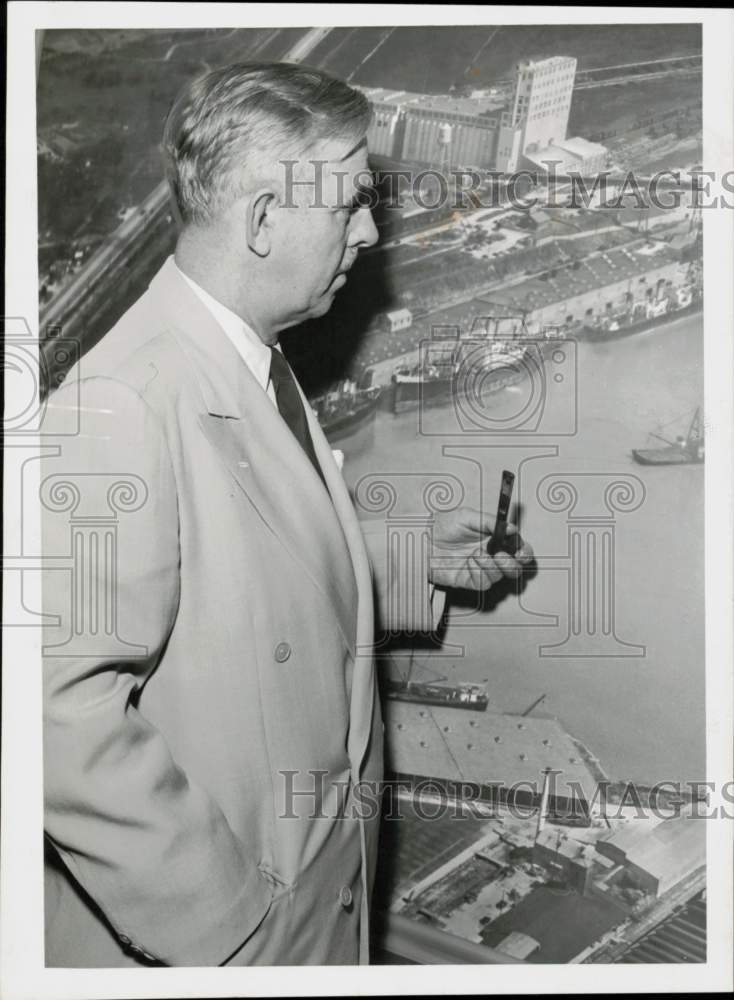 1953 Press Photo Warren P. Lamport studies picture of Houston port. - hpa92796- Historic Images