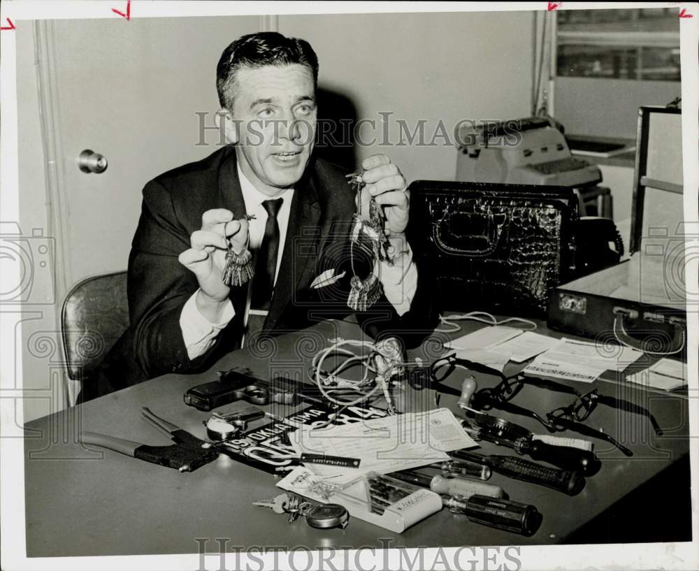 1965 Press Photo Auto Theft Detective A.F. Porat shows tools for stealing cars.- Historic Images