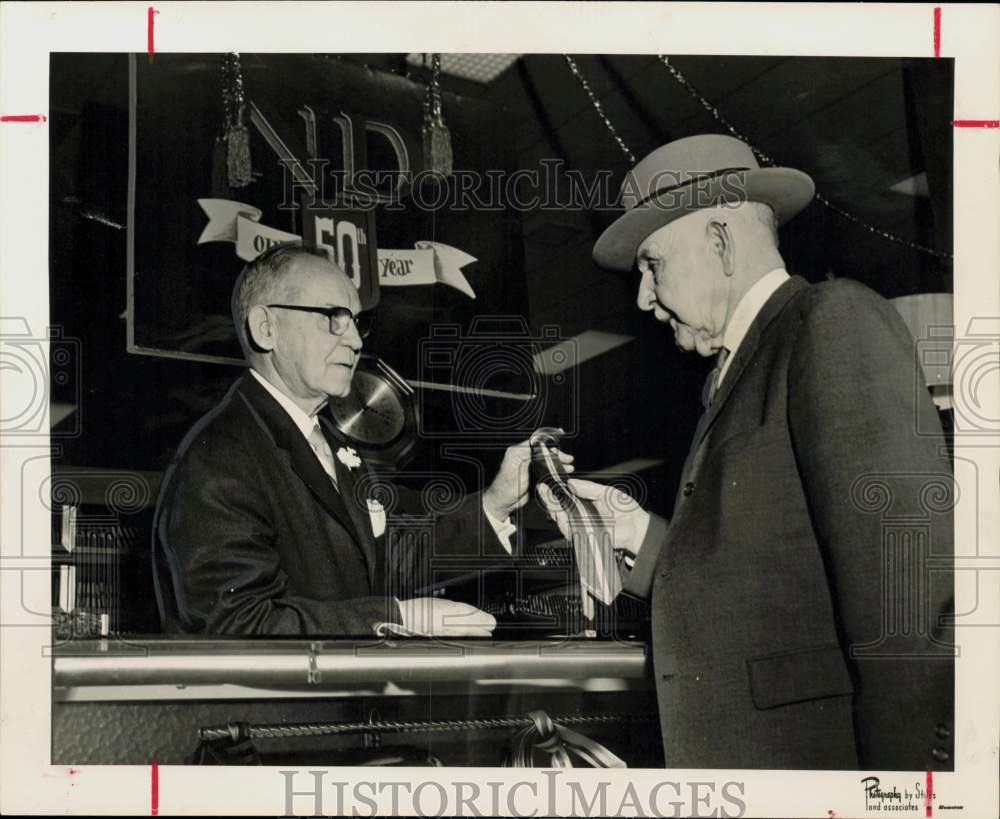 1958 Press Photo Charles Berry and Robert Herndon look over ties at Norton Ditto- Historic Images