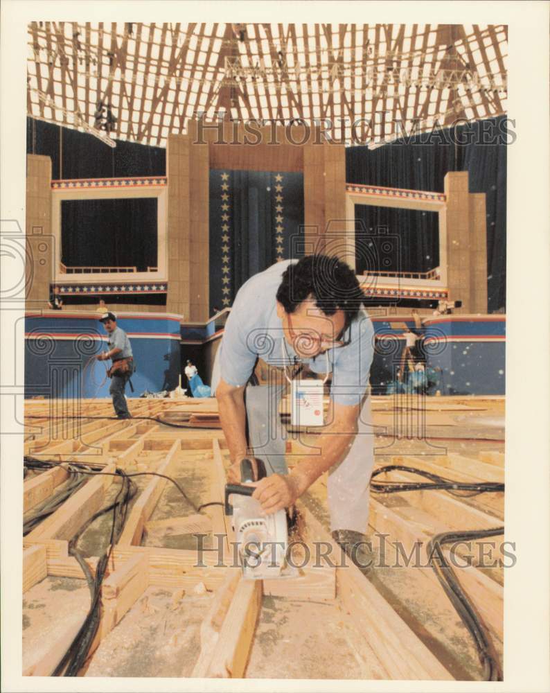 1992 Press Photo Isidro Sosa cuts walkway cable paths at Houston Astrodome.- Historic Images