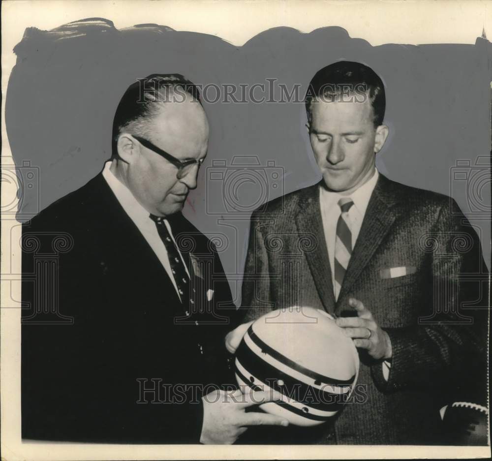 1956 Press Photo Football Frank Broyles examines helmet - hps00998 - Historic Images