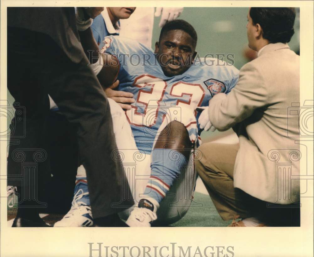 1944 Press Photo Gary Brown, football player, suffers from ankle injury. - Historic Images