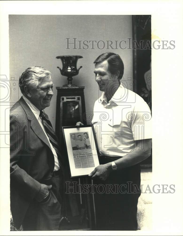 1980 Press Photo J.R. Butler and son read golf expertise article. - hps01451 - Historic Images