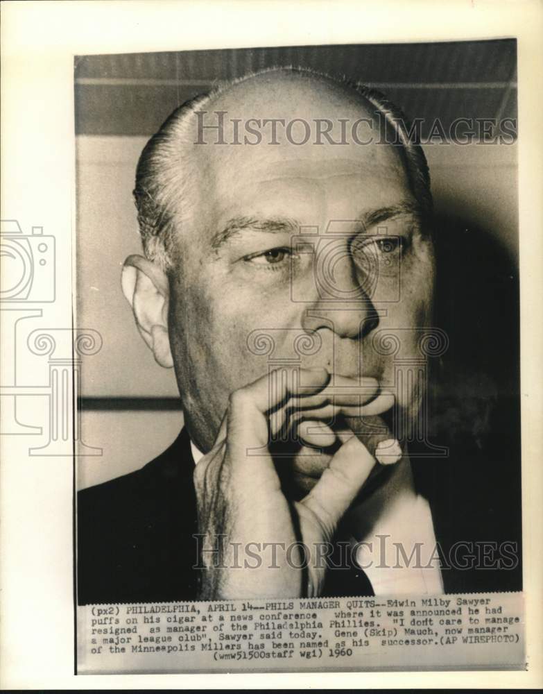 1960 Press Photo Edwin M. Sawyer puffs cigar at Philadelphia news conference. - Historic Images