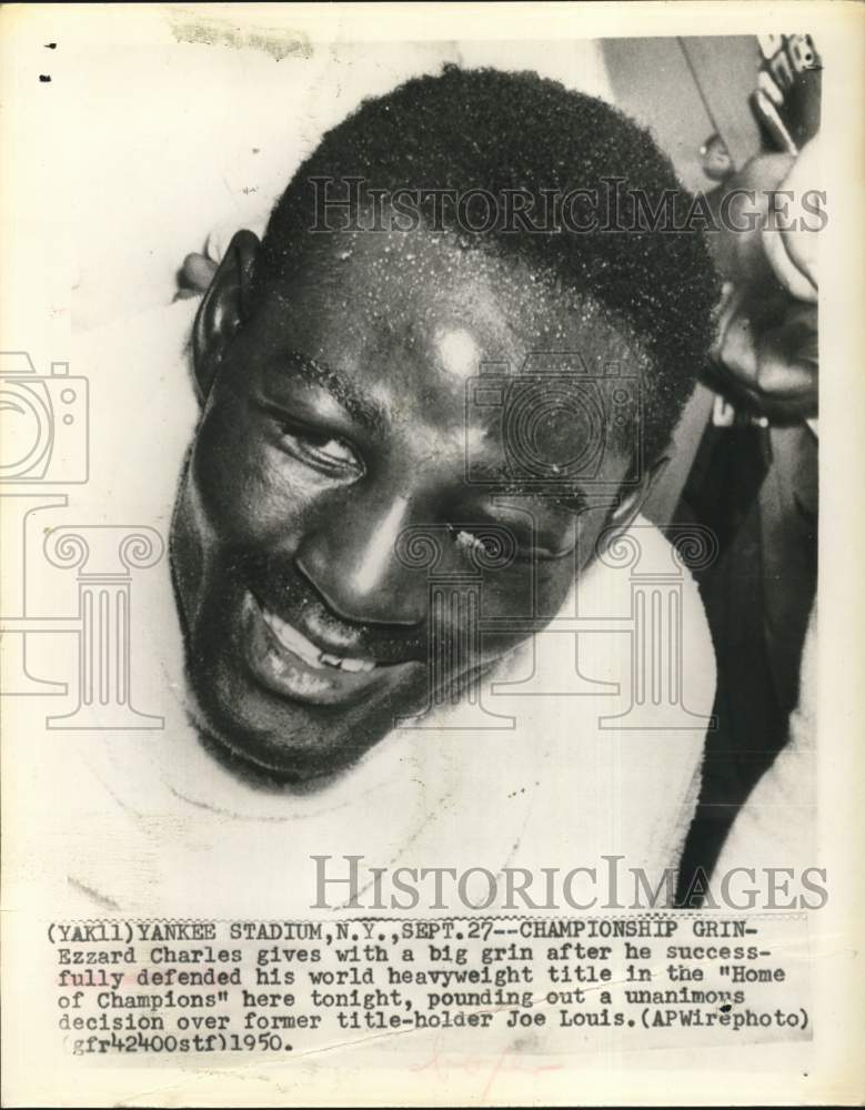 1950 Press Photo Boxer Ezzard Charles grins after Home of Champions victory.- Historic Images