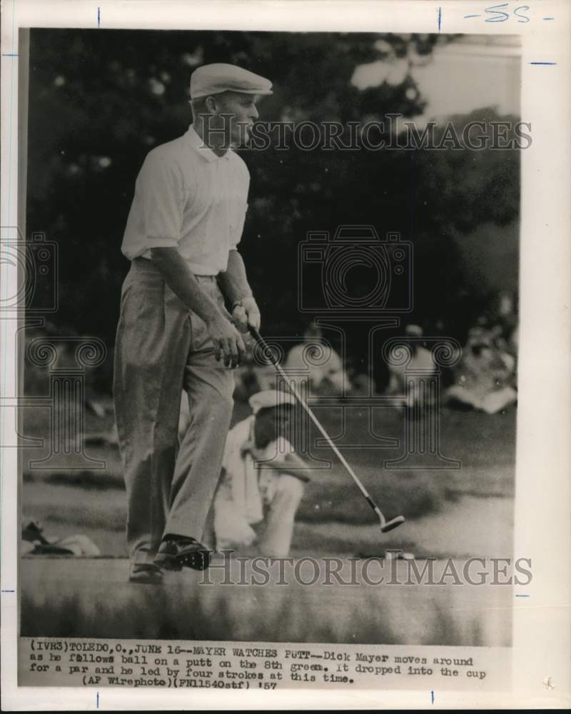 1957 Press Photo Dick Mayer moves and follows 8th green putt in Toledo, Ohio.- Historic Images