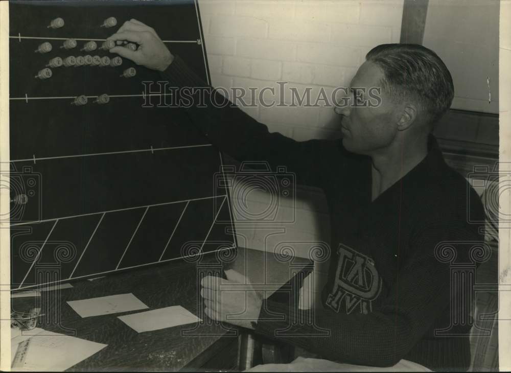 1959 Press Photo Sports figure Tom Dennis at a desk - hps15727- Historic Images