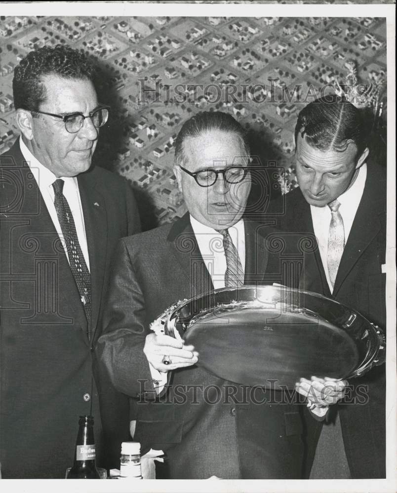 1957 Press Photo Art Routzong and companions admire sports trophy - hps16960- Historic Images