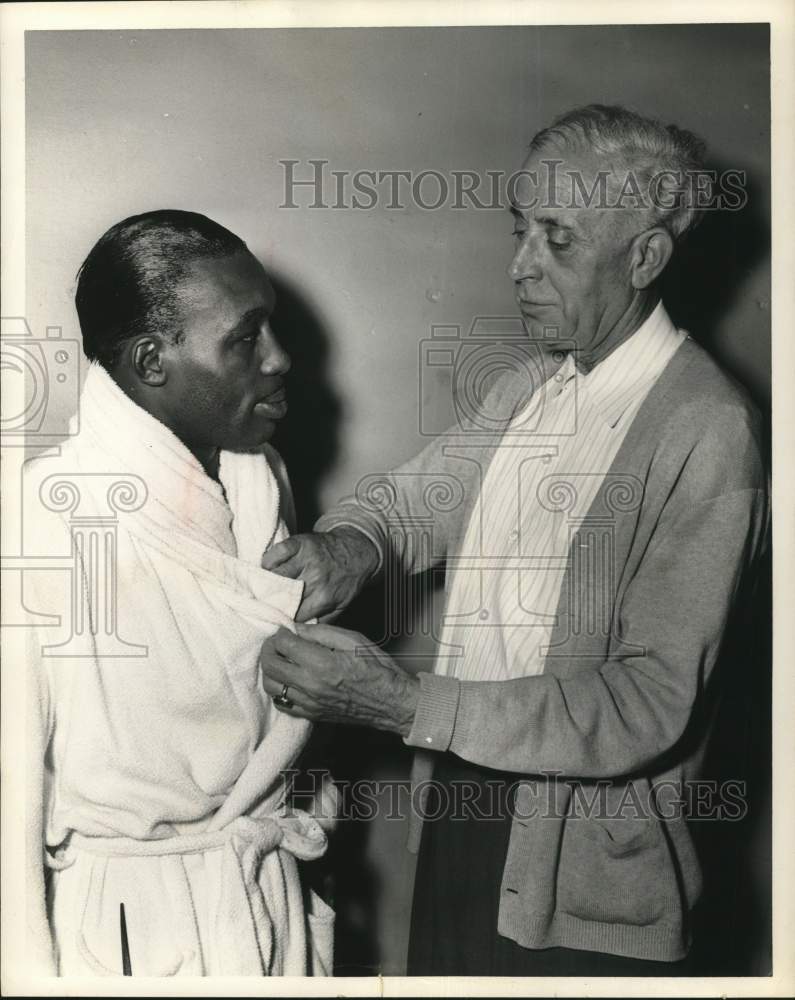 1965 Press Photo Trainer Bill Gore Helps Boxer with Robe - hps20579- Historic Images