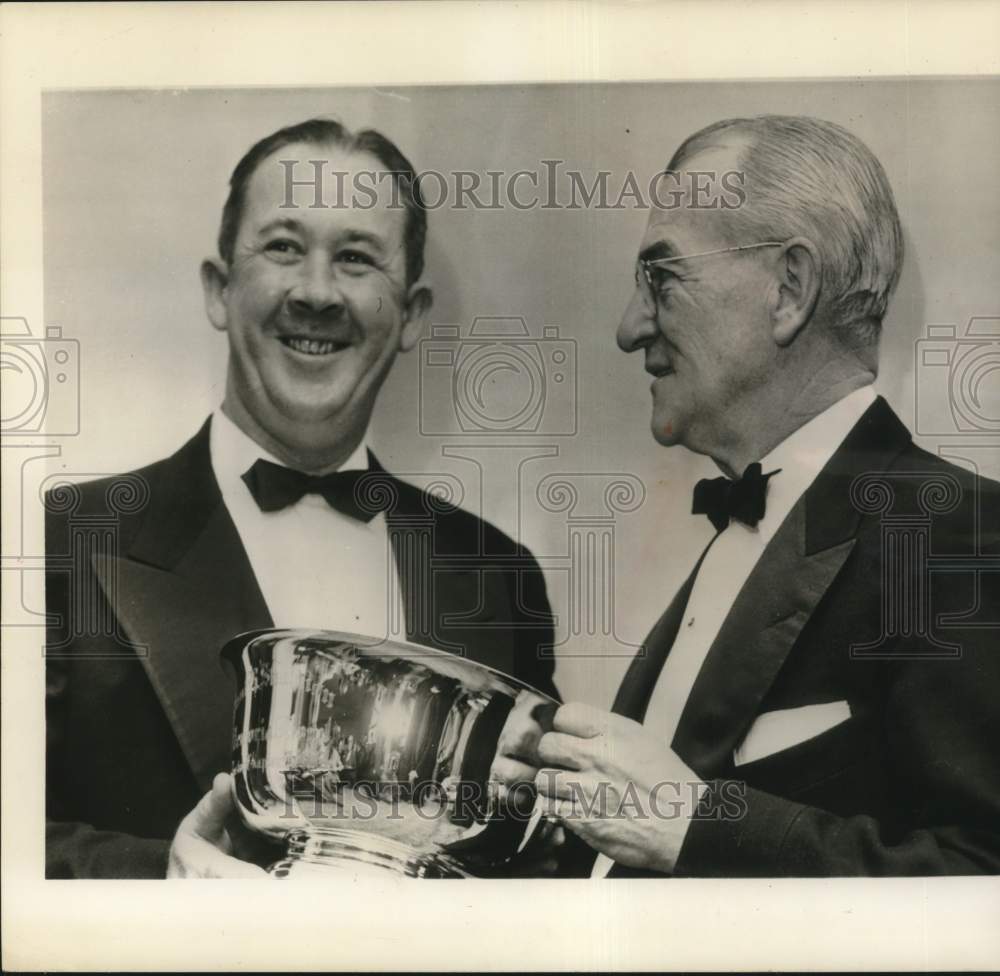 1956 Press Photo Baseball figure Birdie Tebbetts with trophy and companion - Historic Images