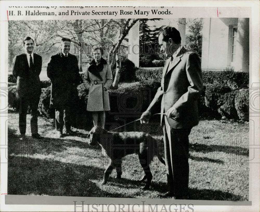 1975 Press Photo Presidential staff presents Richard Nixon with new pet dog, DC- Historic Images