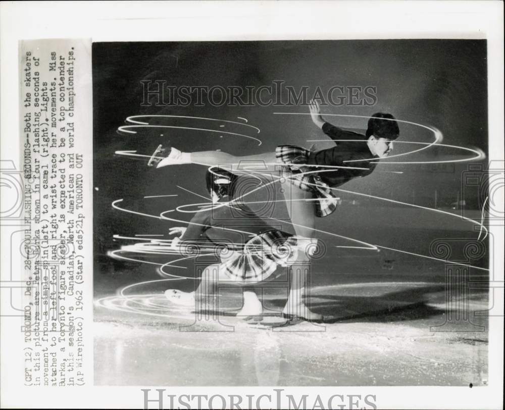 1962 Press Photo Figure skater Petra Burka spins with lights in Toronto, Canada - Historic Images