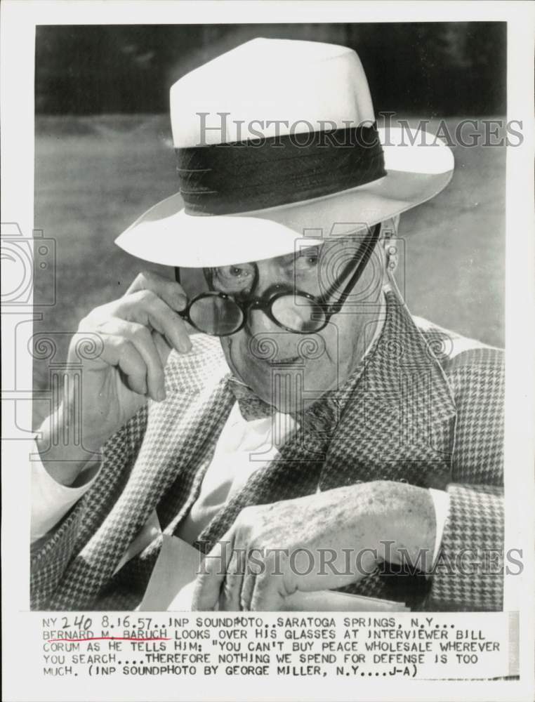 1957 Press Photo Bernard Baruch looks over glasses at interviewer in New York.- Historic Images