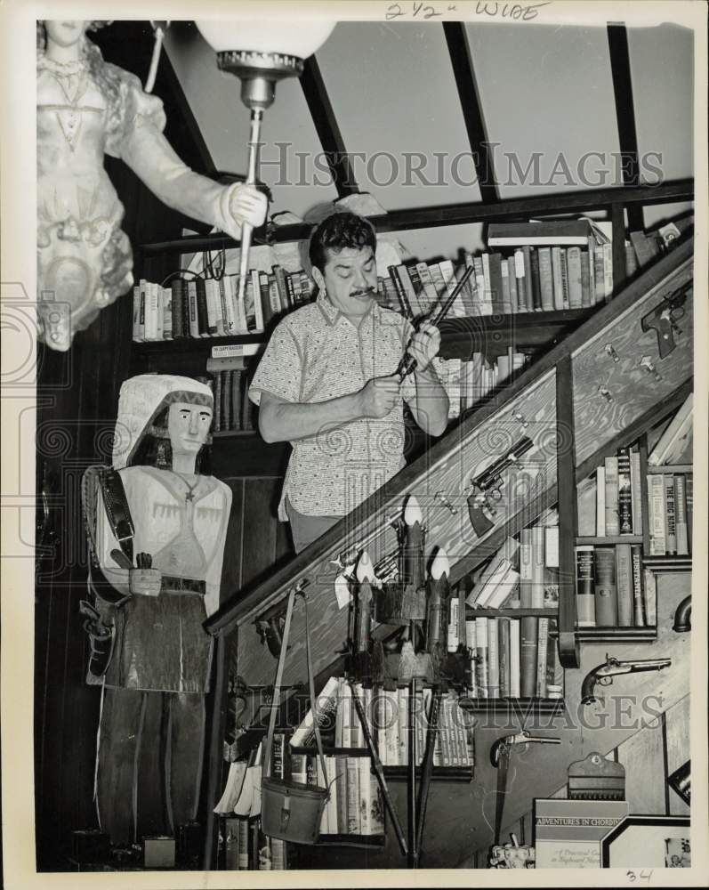 1962 Press Photo Comedian Ernie Kovacs Examines Antique Revolver - kfx03124- Historic Images