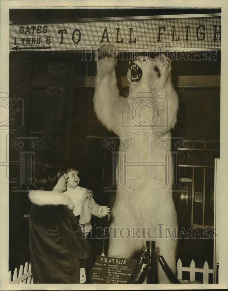 1964 Clara Fetkowitz holds daughter, Adrianne at Eastern Airlines-Historic Images