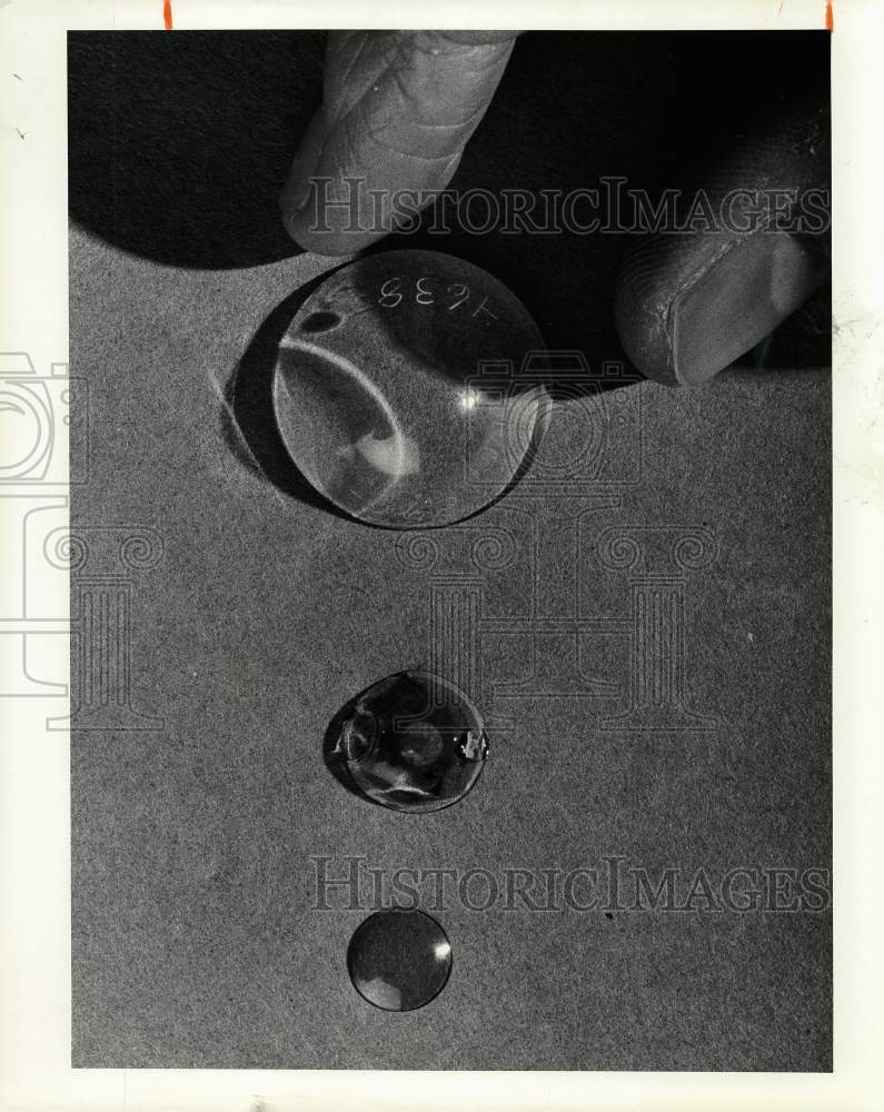 1982 Press Photo Three contacts showing the evolution of lenses over 50 years- Historic Images