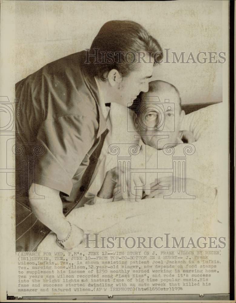 1974 Press Photo J. Frank Wilson assists Joel Jackson in a Lufkin nursing home- Historic Images