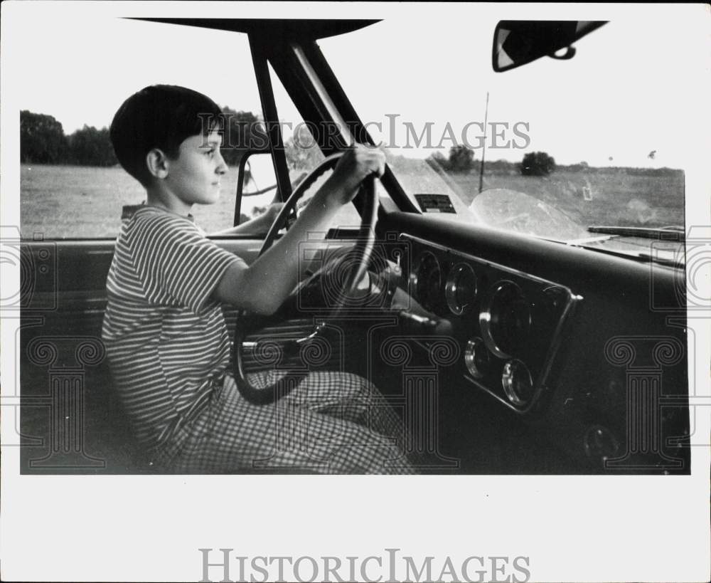 1972 Press Photo Young boy at driver&#39;s seat of truck - lra74396- Historic Images