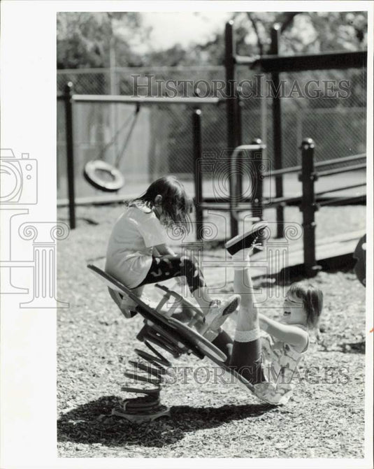 1992 Press Photo Renee Sabonis & Kristen Seitmetz playing on teeter-totter, IL- Historic Images
