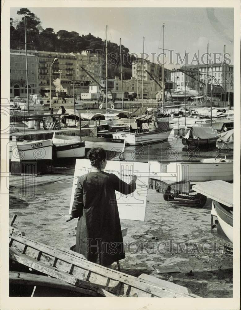 1964 Press Photo Young boy painting the boats at a harbor in France - lrb12027- Historic Images