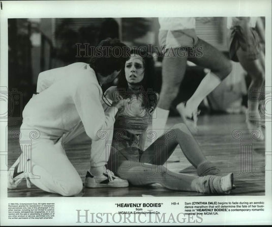1984 Cynthia Dale in a romantic musical film "Heavenly Bodies," - Historic Images