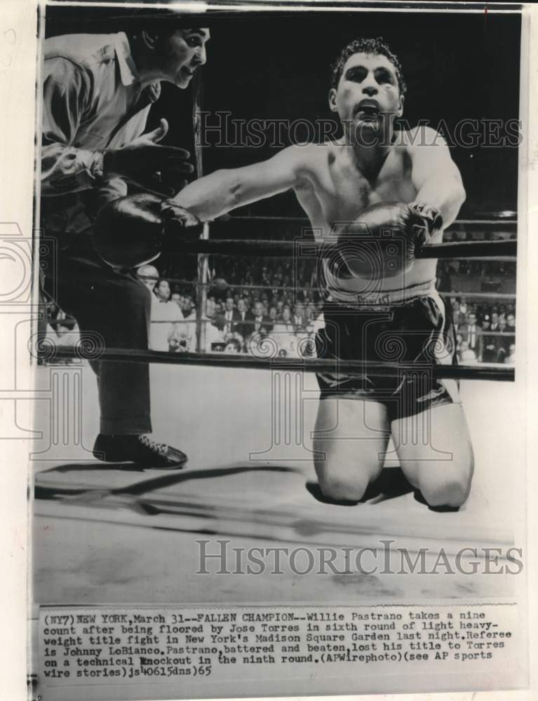 1965 Willie Pastrano takes a nine count after being knocked down - Historic Images