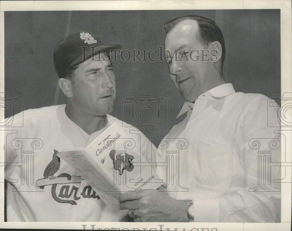 1958 Writer Bob Broeg checks St. Louis roster with Fred Hutchinson. - Historic Images