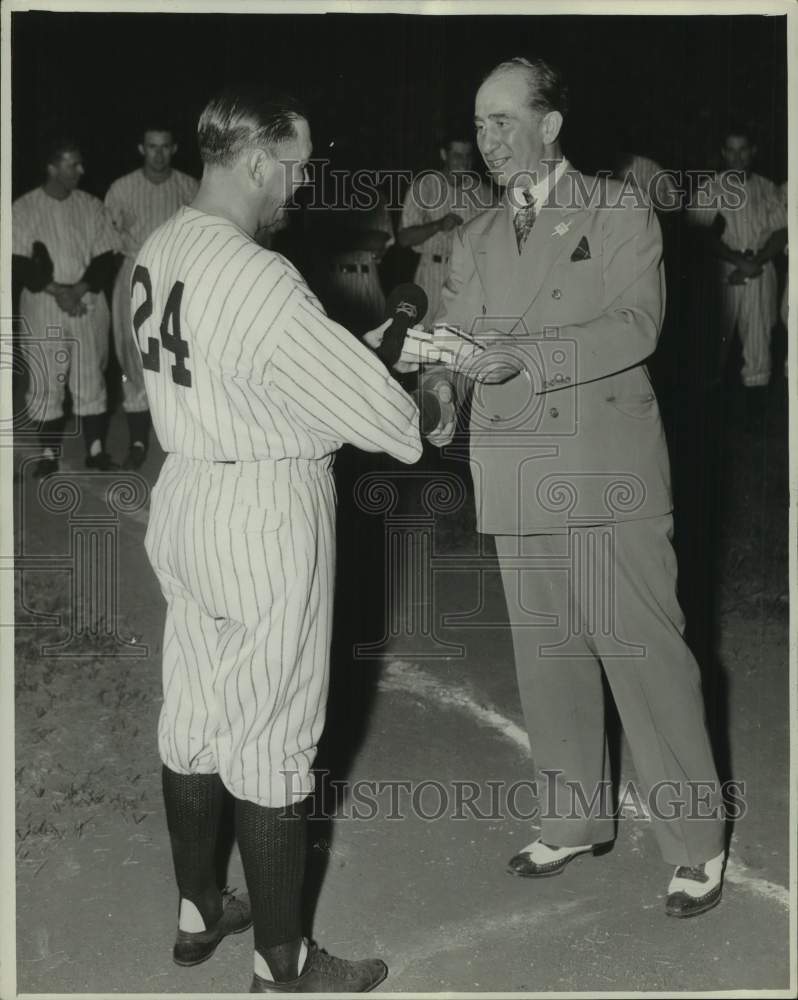 Manager Johnny Neun receives watch from George Troutman before game - Historic Images