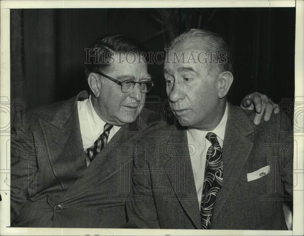 1957 Minor League head George Trautman huddles with Branch Rickey - Historic Images