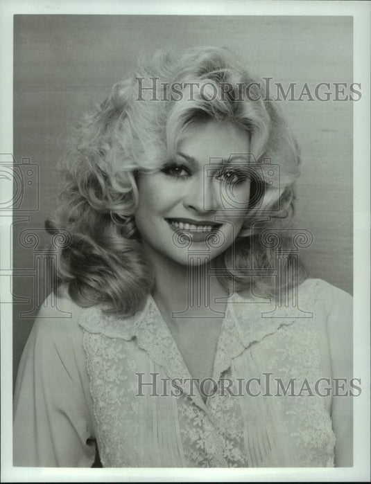 1983 Rachel Dennison stars as Doralee in TV series "9 to 5" - Historic Images