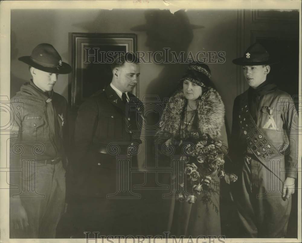 1928 Mrs. Lindbergh receives flowers from the officers - Historic Images