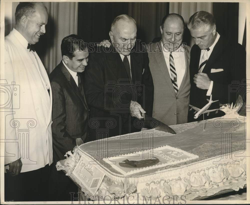 Captain Eddie Rickenbacker and guests cut the cake - Historic Images