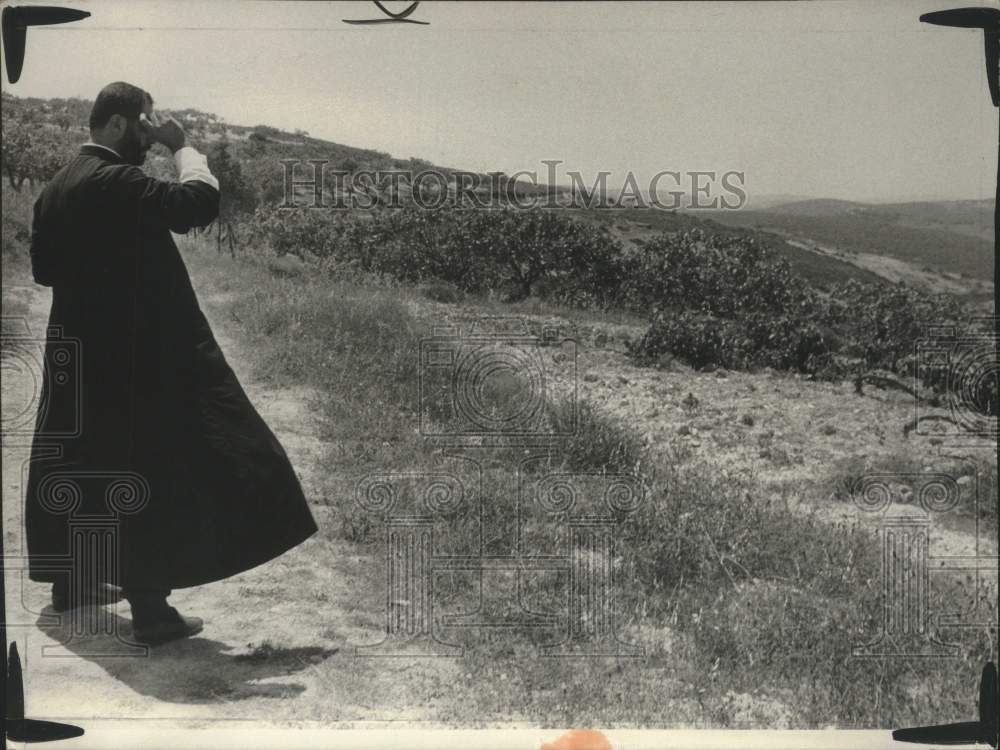 Rev. Kemal Farah Stands on So-Called "Hill of Tears" Homes Destroyed - Historic Images