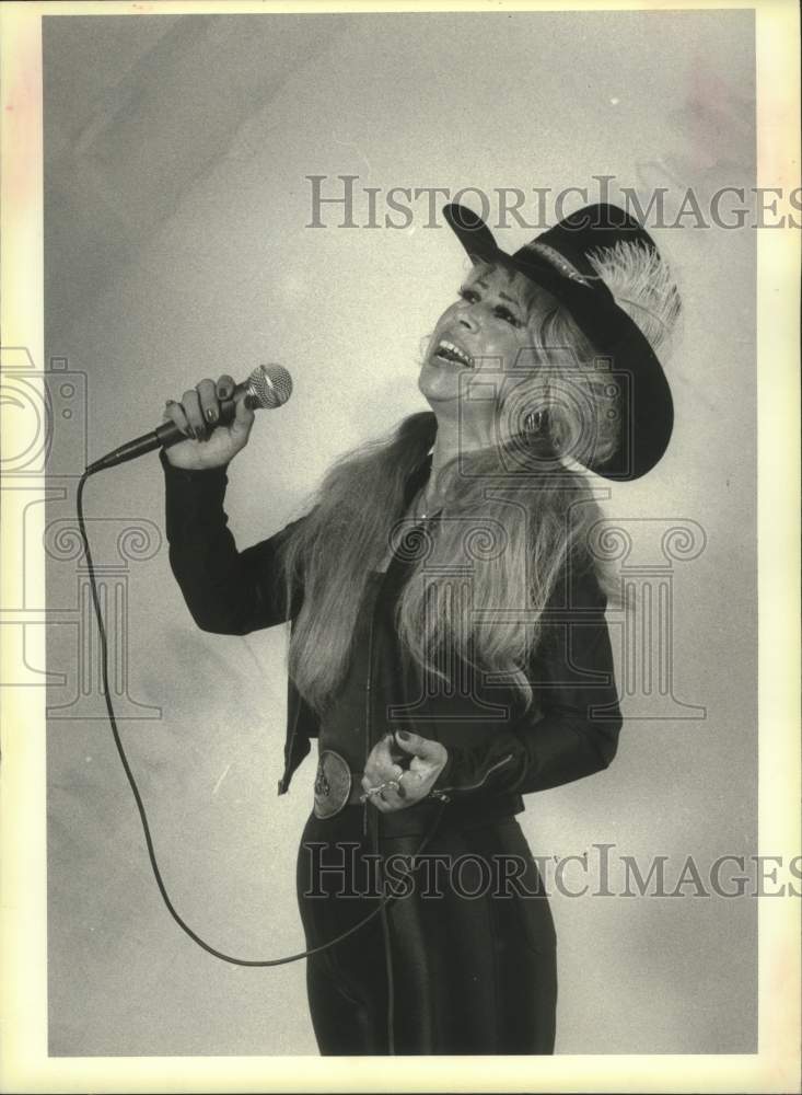 1984 Kerman Singer Alexandria Valdivia sings out a western tune - Historic Images