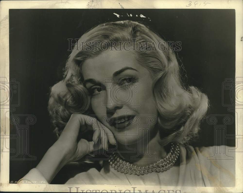 1947 American film actress Anita Louise poses for a photograph - Historic Images